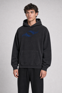 Unisex Vintage Wash Boxy Fleece Hoodie three-quarter view on model